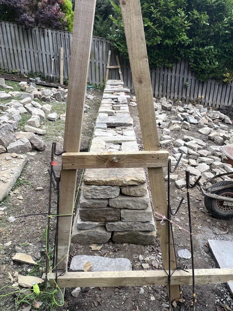 Drystone walling showcasing traditional use of batter frames in  Leeds by Strata Stoneworks