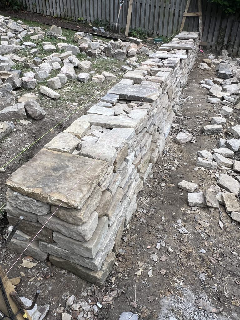 Drystone walling, showcasing through stones and Heritage Craftsmanship  in Leeds by Strata Stoneworks