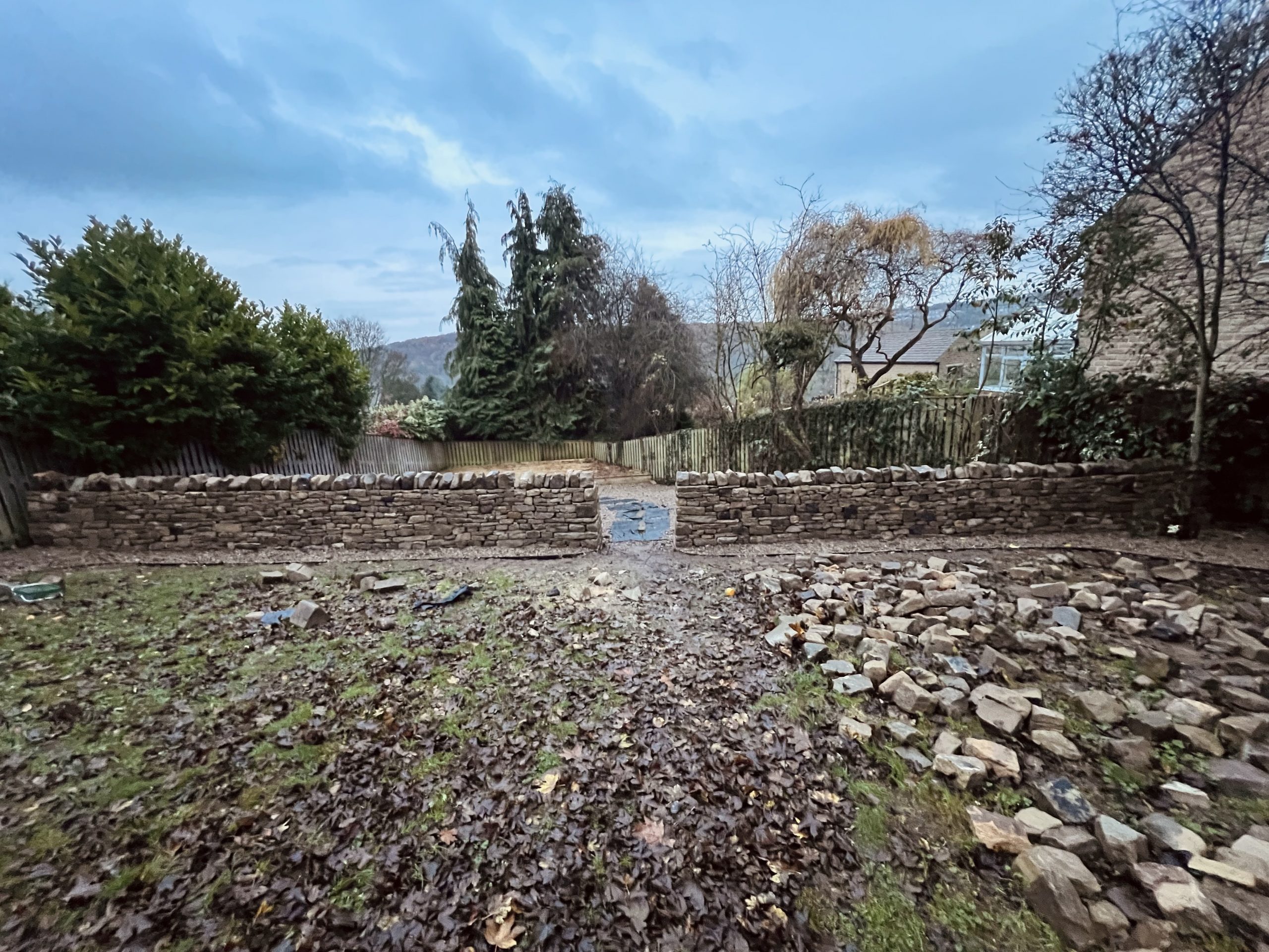 Freestanding Drystone wall with entrance cheek ends in Leeds by Strata Stoneworks